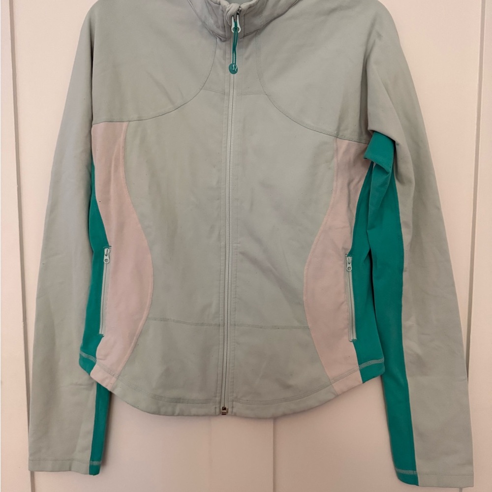 Lululemon Define Jacket in a mint green and teal color